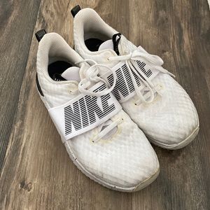 White Nike’s. Size 7. Worn but still in good shape. They’re not broken down.